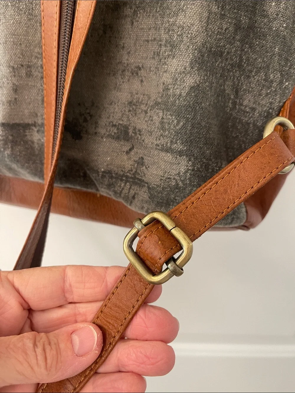 Black Leather Backpack with Brown Trim and Brass Accents